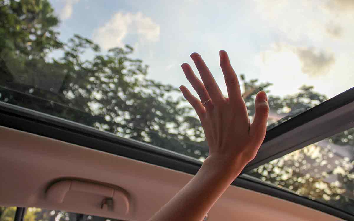 There's no doubt about it – sunroofs are popular. According to a study by the National Automobile Dealers Association, around 25 percent of all new vehicles sold in the United States in 2016 had a sunroof. But just how effective are they at cooling the cabin? In this article, we'll take a look at some of the factors that play into how well a sunroof can keep your car cool during the summer months. So, how effective is the sunroof in cooling the cabin? The answer to that question depends on a few factors. The size of the sunroof, the placement of the sunroof, and the tint of the sunroof all play into how effective it is at cooling the cabin. Keep reading to get detailed explanations. Purpose of a sunroof in cars? Before we talk about how effective a sunroof is in cooling the cabin first let us talk about its purpose, Sunroofs were originally designed for luxury vehicles. Back in the day, only high-end cars had sunroofs because they were such a novelty. Nowadays, sunroofs are available in all sorts of vehicles from economy cars to full-size SUVs. The purpose of a sunroof is to let sunlight and fresh air into the cabin. This is especially nice on a beautiful day when you want to enjoy the weather but doesn't necessarily want to deal with the elements like wind and rain. Sunroofs can also be opened a crack to ventilate the cabin without letting in too much sunlight. Effectiveness of sunroof in cooling the cabin Now that we know the purpose of a sunroof, let's talk about how effective they are in cooling the cabin. The answer to this question depends on four main factors: size, placement, angle, and tint. 1. Size The first, and perhaps most obvious, is size. The size of the sunroof plays a big role in how effective it is at cooling the cabin. A small sunroof is not going to do much to cool the cabin, but a large sunroof can make a significant difference because it lets in more sunlight and fresh air. On a very hot day, A larger sunroof will admit more sunlight and fresh air than a smaller one. Have you noticed that on a hot day, the car with the sunroof open is usually cooler than the car without a sunroof? That's because the sunroof helps to ventilate the cabin and circulate air from outside rushing in and filling up the cabin. When the sunroof is only open a crack, there's not as much of a difference, but you'll still notice that the car cools more quickly when the sunroof is fully open. 2. Placement Another factor that plays into how effective the sunroof is in cooling the cabin is placement. If you have a sunroof that's placed near the front of the car, it will do a better job of cooling the cabin because the air will be circulated better. However, if the sunroof is placed near the back of the car, it won't be as effective at cooling the cabin. This is because when the sunroof is placed near the back of the car, the air doesn't circulate as well and it doesn't cool the cabin as effectively. 3. Tint The third factor that plays into how effective a sunroof is in cooling the cabin is tint. The tint of the sunroof also has an effect on how well it cools the cabin. A light-colored sunroof will reflect more sunlight and heat than a dark-colored sunroof. This means that a light-colored sunroof will do a better job of cooling the cabin than a dark-colored sunroof. 4. Angle The final factor is the angle of the sunroof. If the sunroof is tilted at a steeper angle, it will admit less heat than if it's parallel to the glass. This is because the sunroof is acting as a shield, blocking some of the heat from the sun. When it's tilted at a steeper angle, it's more effective at blocking the heat. Now that we've looked at all of the factors that play into how effective a sunroof is in cooling the cabin, let's put them all together and see what we can conclude. When it comes to size, the larger the sunroof, the more air it will admit. But, placement is also important. If the sunroof is placed closer to the front of the car, it will also admit more air. And, finally, tint also makes a difference. A darker tint will block more of the sunlight and thus keep the cabin cooler. So, if you're looking for a sunroof that will help keep your car cool during the summer, look for a large sunroof that's placed towards the back of the car and has a darker tint. following these guidelines will help you find a sunroof that's more effective at cooling the cabin. Keep reading to find out ways to keep your car cool during the summer Ways to keep your car cool during the summer (Tips & tricks) There are several ways to keep your car cool during the summer. Many of these are common sense, but some of them may surprise you. 1. Park in the shade One of the best ways to keep your car cool during the summer is to park in the shade. This will help prevent the car from heating up in the first place. When you leave your car parked outside in the scorching sun, the interior can heat up to dangerously high temperatures. 2. Use a sunshade Another way to keep your car cool during the summer is to use a sunshade. A sunshade is a piece of fabric that you place over the windshield to block the sun. This can help keep the car cooler, even when it's parked in the sun. 3. Crack the windows Another way to keep your car cool during the summer is to crack the windows. This will allow for air circulation and will help prevent the car from becoming a sauna. Just be sure not to crack the windows too much, or you'll defeat the purpose. 4. Use a sunshade Another way to keep your car cool during the summer is to use a sunshade. A sunshade is a piece of fabric that you place over the windshield to block the sun. This can help keep the car cooler, even when it's parked in the sun. 5. Turn on the AC One of the most obvious ways to keep your car cool during the summer is to turn on the air conditioning. The AC will help circulate cool air and keep the car from becoming a hot box. 6. Use your fan wisely Another way to keep your car cool during the summer is to use your fan wisely. If you have the AC on, make sure that you're not also using the fan on high. This can cause the AC to work less effectively. By following these tips, you can help keep your car cool during the summer and prevent it from becoming a hot box. Final Thought As discussed sunroofs in cars have an advantage in keeping your car cool over the summer. By following the tips in this article, you can make sure that your sunroof is working effectively to keep your car cool. Do you have any other tips for keeping your car cool during the summer? Let me know in the comments below!